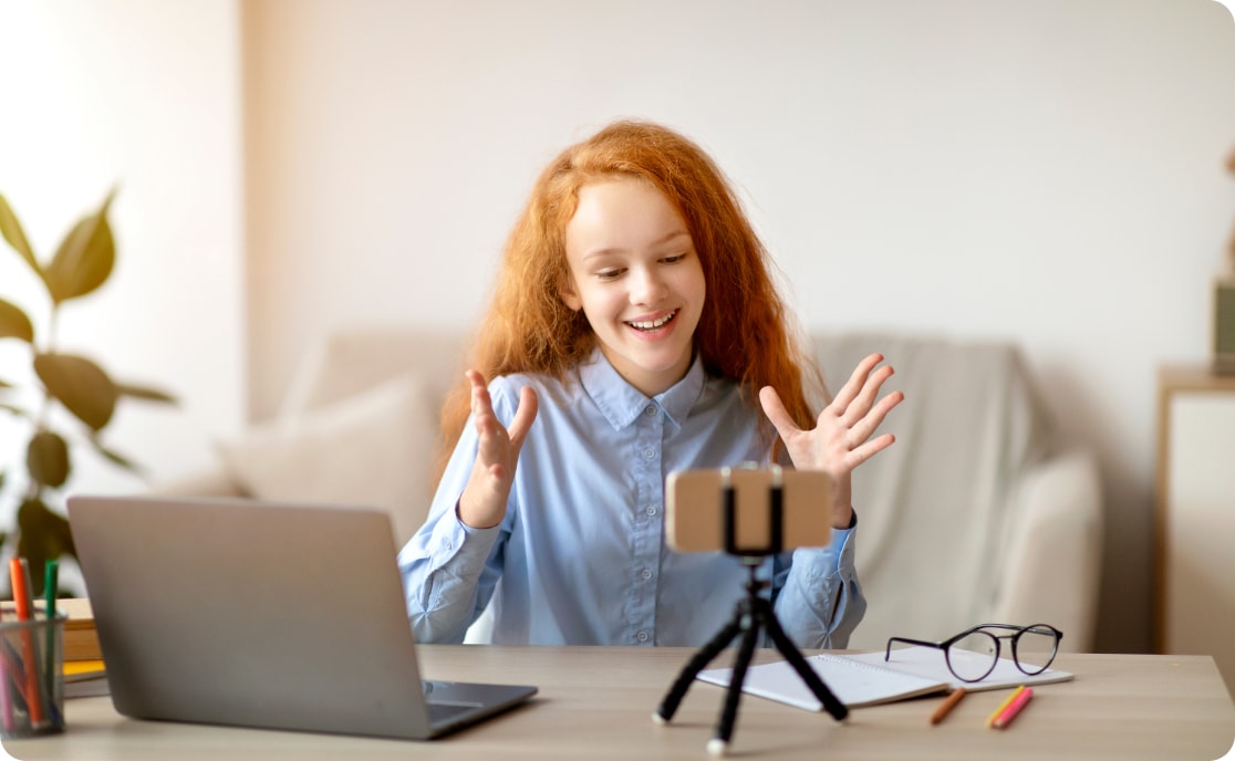 student recording a video on her cell phone