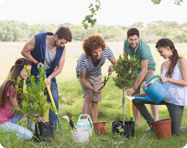 multiple people helping out in the community planting plants