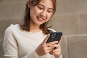 girl using app to edit video on smartphone