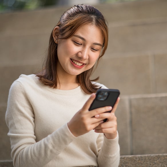 girl using app to edit video on smartphone