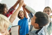 group of kids high fiving