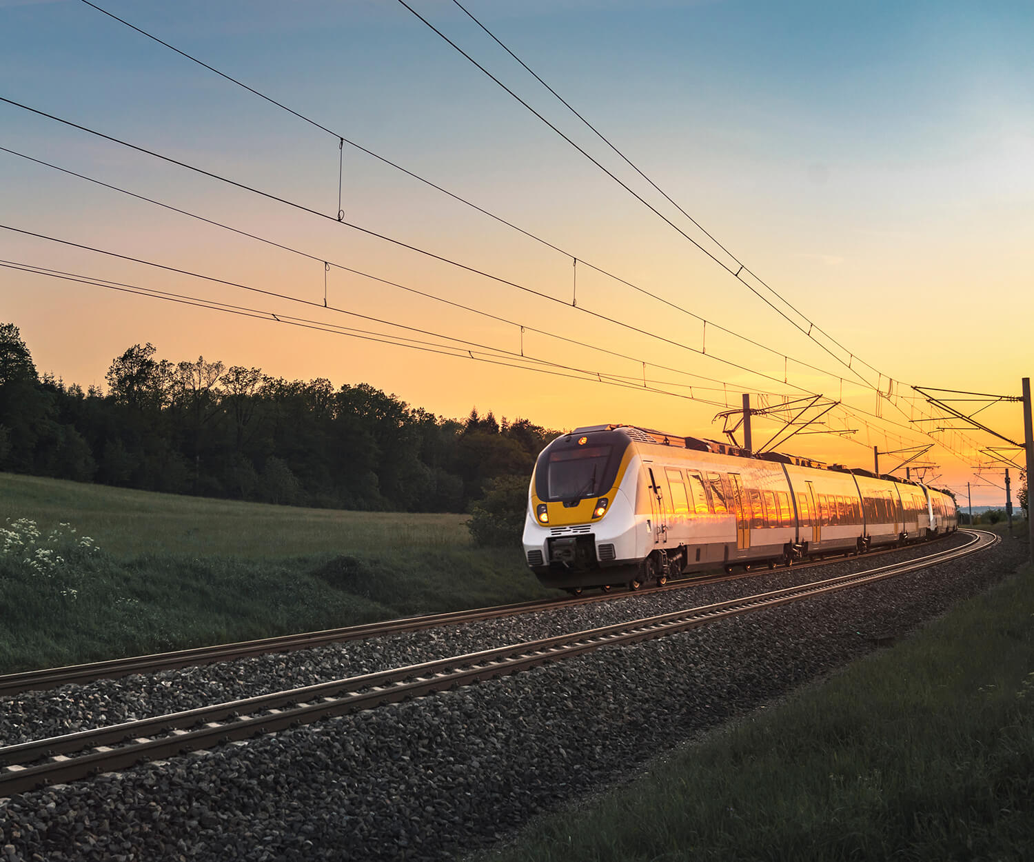 train going through the countryside at sunset