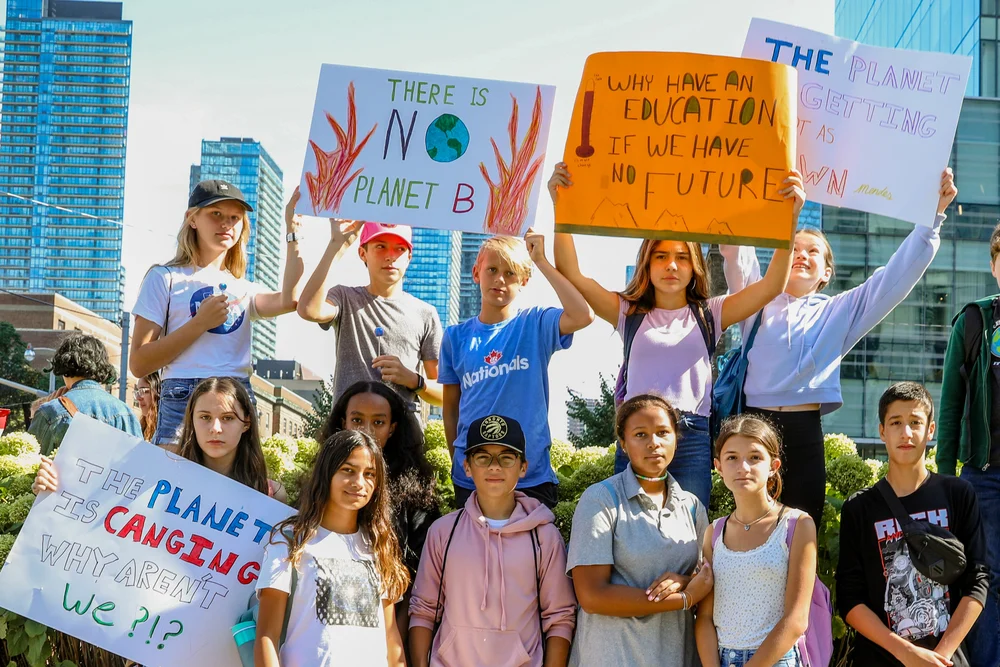 Young activists taking part in a climate change protest.