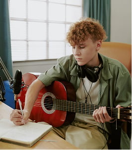 student playing guitar