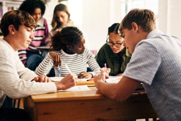 students working together on world of 8 billion project